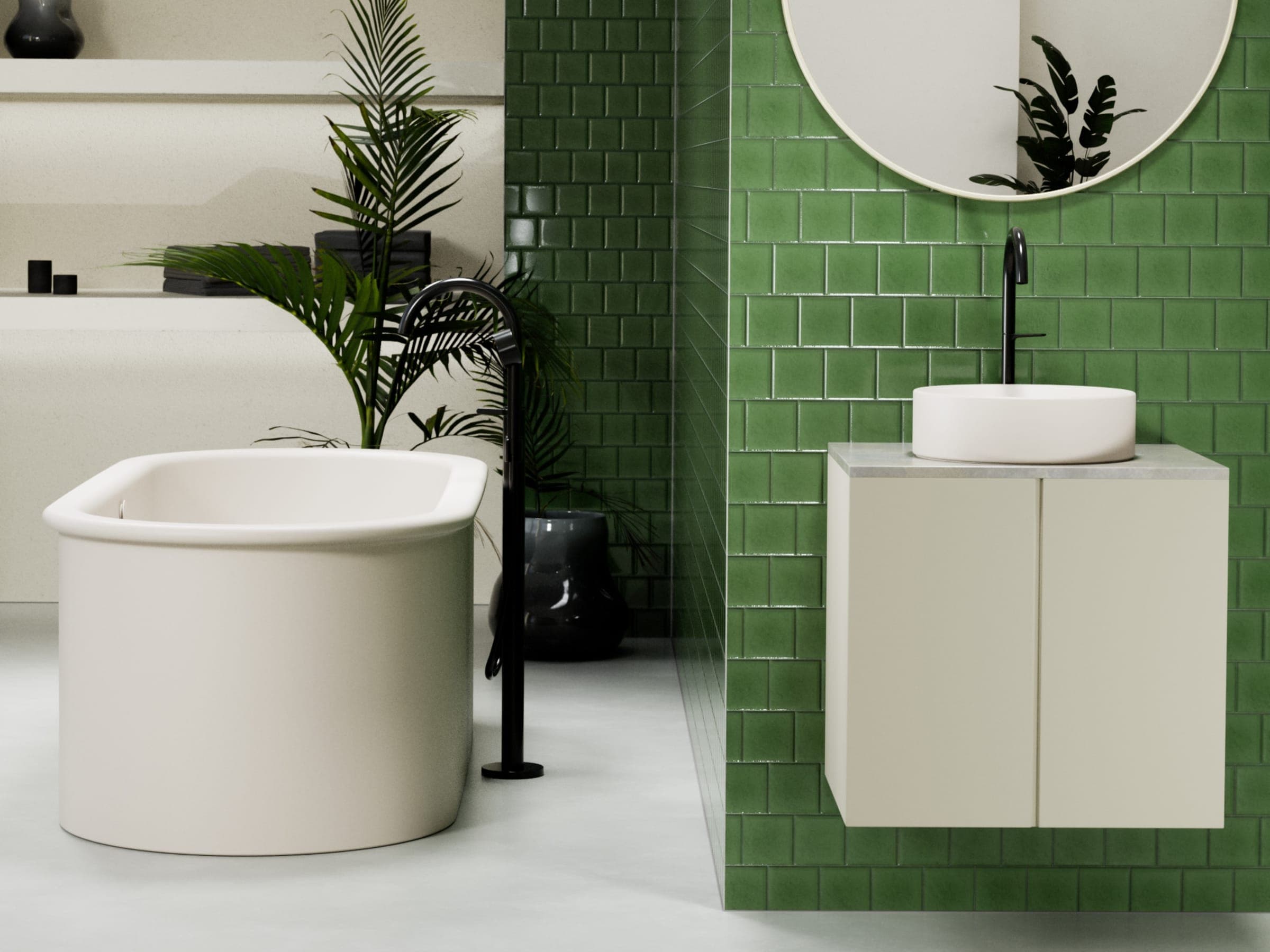 Tina exenta oval color crema con llave de piso negra y, a la derecha, un lavabo redondo de sobreponer sobre un mueble claro, frente a un muro de azulejo verde brillante con espejo redondo; plantas al fondo.