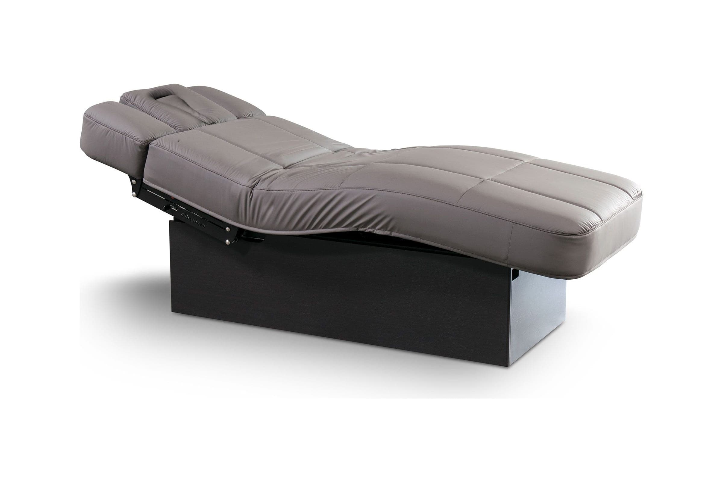 Mesa de spa MO1 Evo con tapizado gris topo acolchado y base negra, sobre fondo blanco