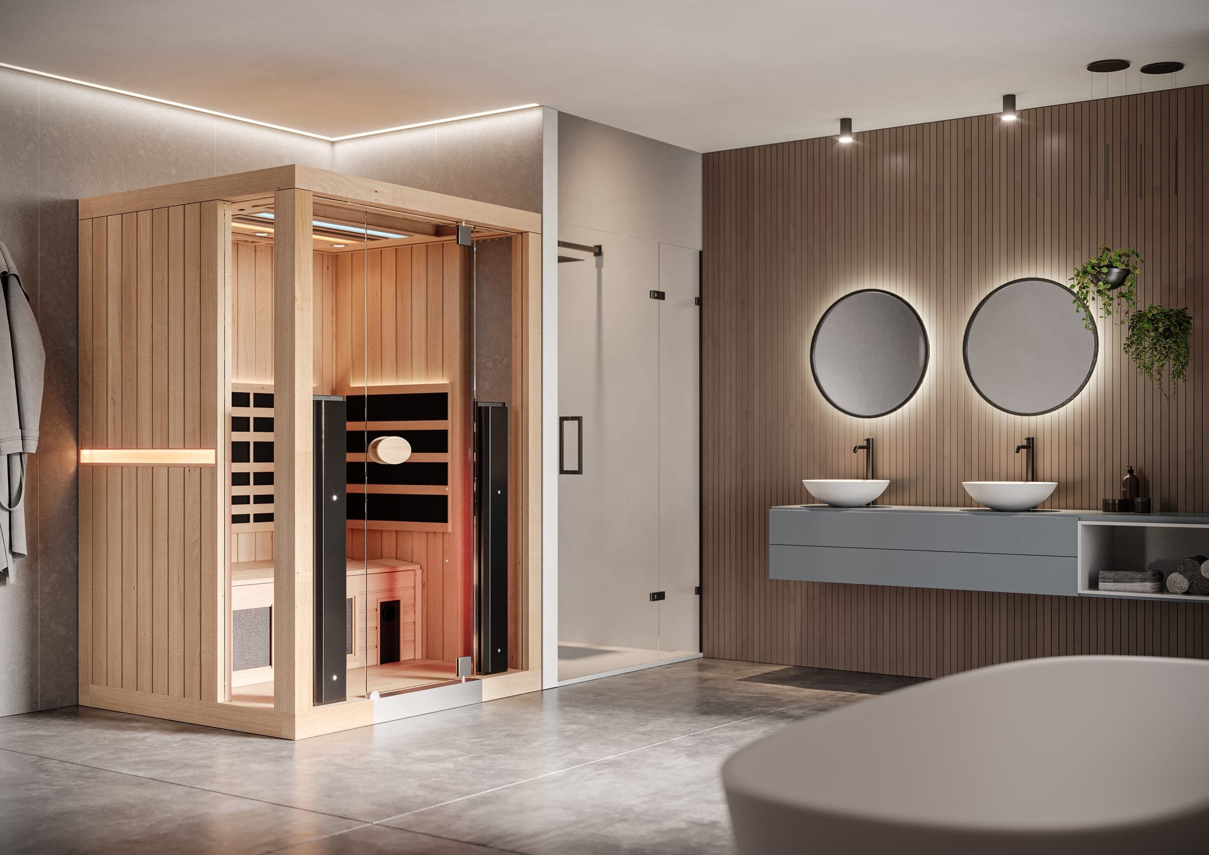 Sauna de madera clara con frente de vidrio, banco interior y paneles negros de calentadores, en un baño de piso de concreto con muro de listones de madera, dos espejos redondos retroiluminados sobre lavabos de sobreponer, una regadera de vidrio y, en primer plano, una tina blanca desenfocada.