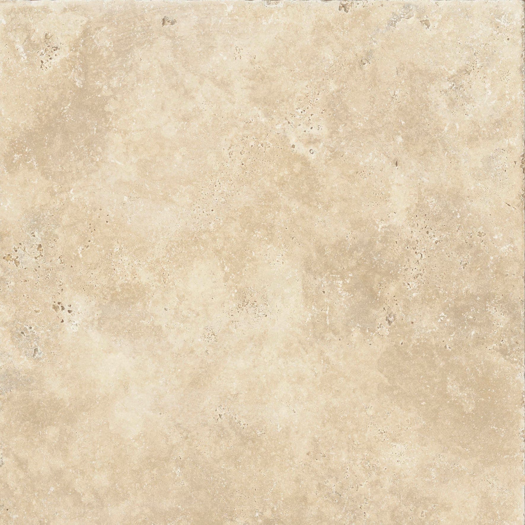 Superficie beige de aspecto pétreo, con poros pequeños y manchas en tonos crema y arena.